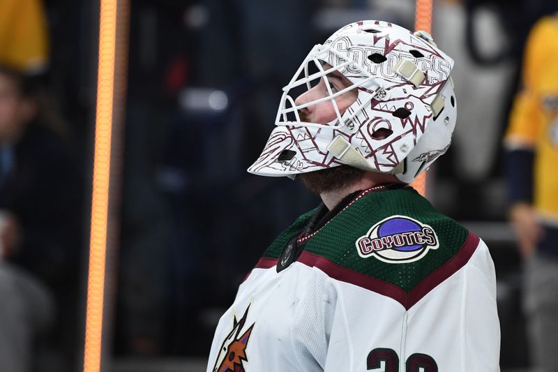 Nov 11, 2023; Nashville, Tennessee, USA; Arizona Coyotes goaltender Connor Ingram (39) reacts after allowing a goal during the first period against the Nashville Predators at Bridgestone Arena. Mandatory Credit: Christopher Hanewinckel-USA TODAY Sports