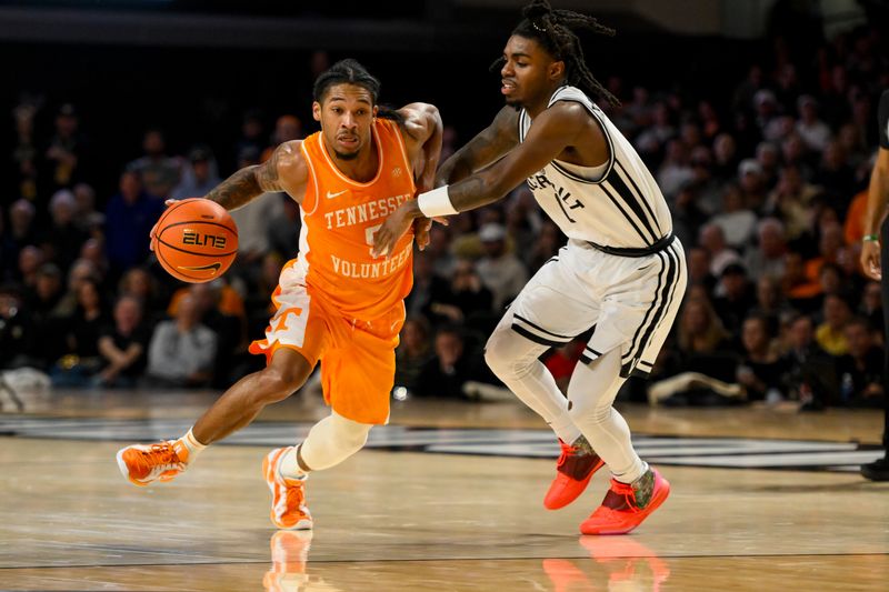 Jan 18, 2025; Nashville, Tennessee, USA;  Tennessee Volunteers guard Zakai Zeigler (5) dribbles the ball past Vanderbilt Commodores guard Jason Edwards (1) during the second half at Memorial Gymnasium. Mandatory Credit: Steve Roberts-Imagn Images