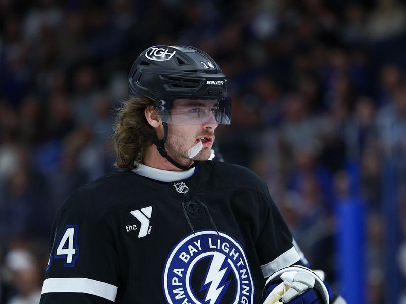 Nov 16, 2024; Tampa, Florida, USA; Tampa Bay Lightning center Conor Geekie (14) looks on during a break in play against the New Jersey Devils in the first period at Amalie Arena. Mandatory Credit: Nathan Ray Seebeck-Imagn Images