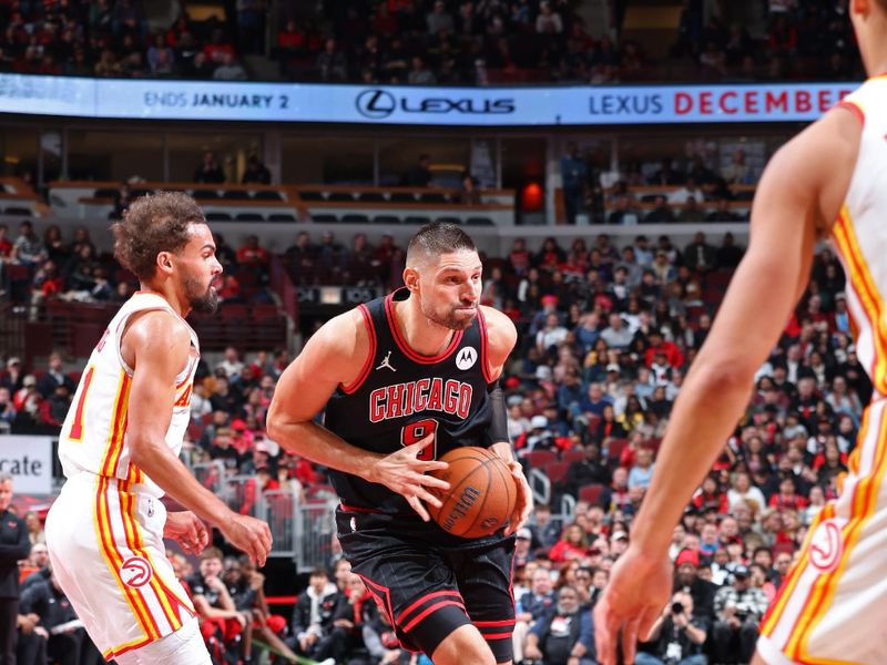 CHICAGO, IL - NOVEMBER 22: Nikola Vucevic #9 of the Chicago Bulls handles the ball during the game against the Atlanta Hawks during the Emirates NBA Cup game on November 22, 2024 at United Center in Chicago, Illinois. NOTE TO USER: User expressly acknowledges and agrees that, by downloading and or using this photograph, User is consenting to the terms and conditions of the Getty Images License Agreement. Mandatory Copyright Notice: Copyright 2024 NBAE (Photo by Jeff Haynes/NBAE via Getty Images)