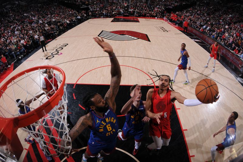 PORTLAND, OR - MARCH 23: Scoot Henderson #00 of the Portland Trail Blazers drives to the basket during the game against the Denver Nuggets on March 23, 2024 at the Moda Center Arena in Portland, Oregon. NOTE TO USER: User expressly acknowledges and agrees that, by downloading and or using this photograph, user is consenting to the terms and conditions of the Getty Images License Agreement. Mandatory Copyright Notice: Copyright 2024 NBAE (Photo by Cameron Browne/NBAE via Getty Images)