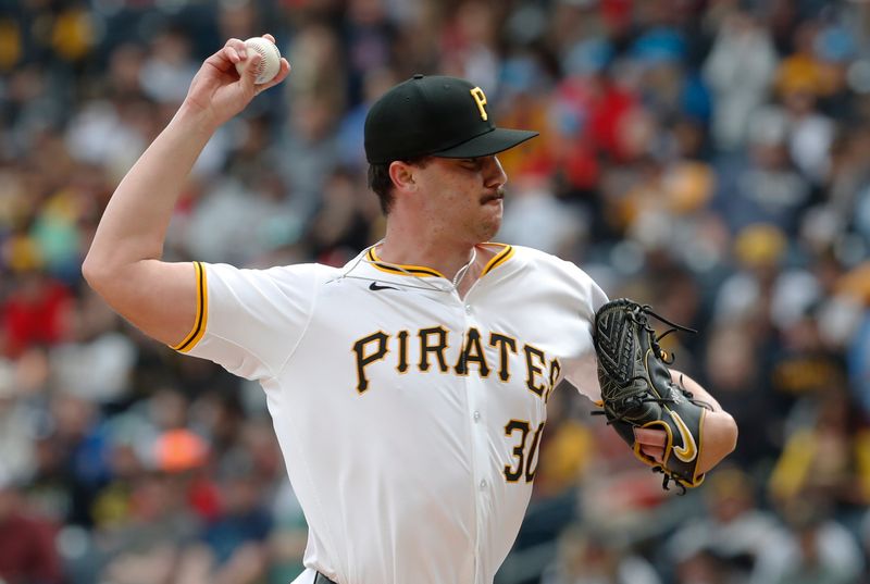 May 11, 2024; Pittsburgh, Pennsylvania, USA;  Pittsburgh Pirates starting pitcher Paul Skenes (30) delivers a pitch in his major league debut against the Chicago Cubs during the first inning at PNC Park. Mandatory Credit: Charles LeClaire-USA TODAY Sports