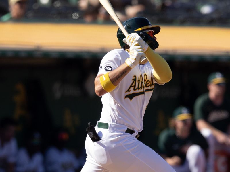 Sep 23, 2023; Oakland, California, USA; Oakland Athletics first baseman Ryan Noda (49) follows through on his RBI double against the Detroit Tigers during the eighth inning at Oakland-Alameda County Coliseum. Mandatory Credit: D. Ross Cameron-USA TODAY Sports