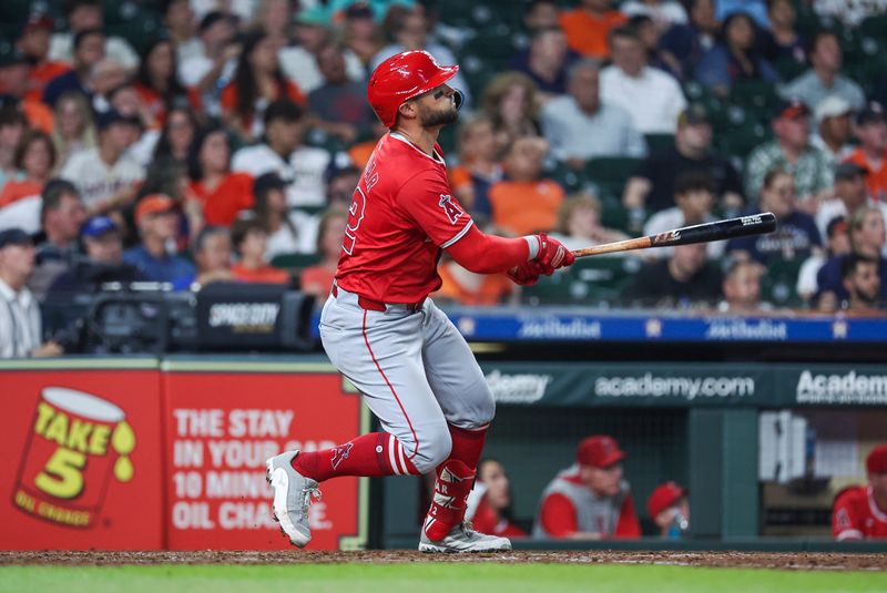 May 21, 2024; Houston, Texas, USA; Los Angeles Angels center fielder Kevin Pillar (12) hits a home run during the seventh inning against the Houston Astros at Minute Maid Park. Mandatory Credit: Troy Taormina-USA TODAY Sports