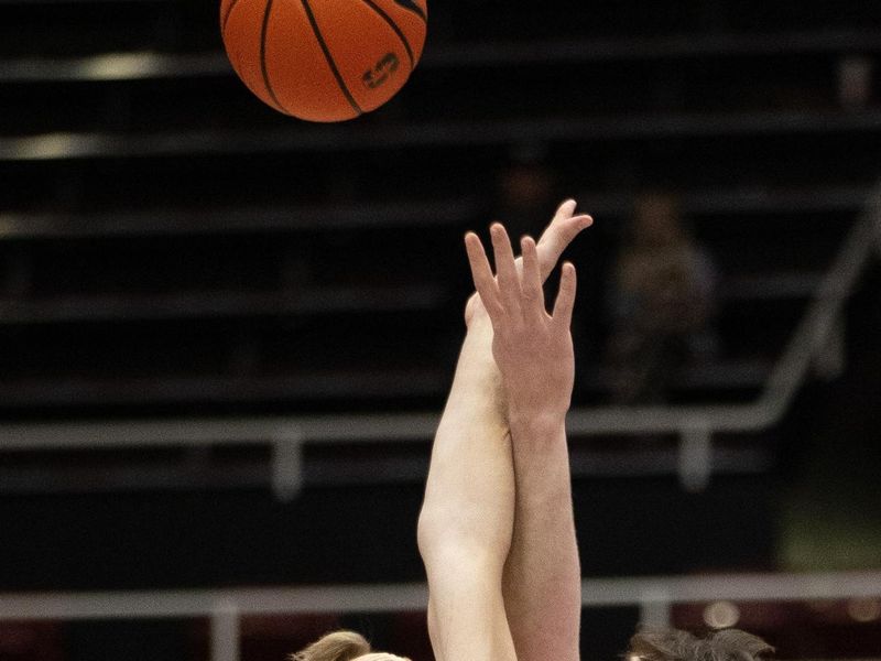 Jan 28, 2023; Stanford, California, USA; California Golden Bears forward Lars Thiemann (left) and Stanford Cardinal forward Maxime Raynaud (42) vie for the opening tip during the first half at Maples Pavilion. Mandatory Credit: D. Ross Cameron-USA TODAY Sports