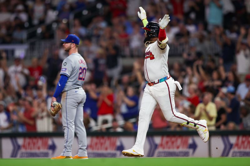 Sep 24, 2024; Atlanta, Georgia, USA; Atlanta Braves designated hitter Marcell Ozuna (20) celebrates after a home run past New York Mets first baseman Pete Alonso (20) in the fifth inning at Truist Park. Mandatory Credit: Brett Davis-Imagn Images