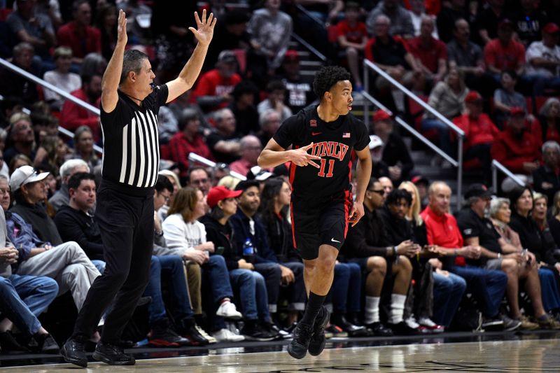 Jan 6, 2024; San Diego, California, USA; UNLV Rebels guard Dedan Thomas Jr. (11) gestures after a three-point basket against the San Diego State Aztecs during the first half at Viejas Arena. Mandatory Credit: Orlando Ramirez-USA TODAY Sports