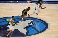 Timberwolves' Edwards and Mavericks' Doncic in a Fierce Battle at Target Center