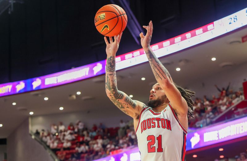 Feb 10, 2025; Houston, Texas, USA; Houston Cougars guard Emanuel Sharp (21) shoots against the Baylor Bears in the first half at Fertitta Center. Mandatory Credit: Thomas Shea-Imagn Images