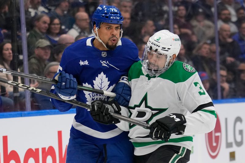 Jan 14, 2025; Toronto, Ontario, CAN; Dallas Stars defenceman Mathew Dumba (3) and Toronto Maple Leafs forward Ryan Reaves (75) collide during the first period at Scotiabank Arena. Mandatory Credit: John E. Sokolowski-Imagn Images