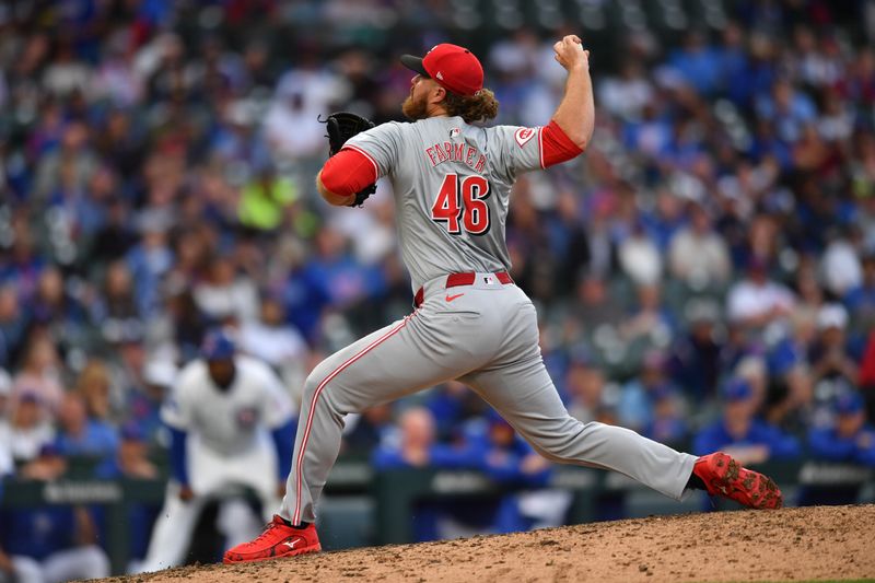 Sep 29, 2024; Chicago, Illinois, USA; Cincinnati Reds relief pitcher Buck Farmer (46) pitches during the tenth inning against the Chicago Cubs at Wrigley Field. Mandatory Credit: Patrick Gorski-Imagn Images