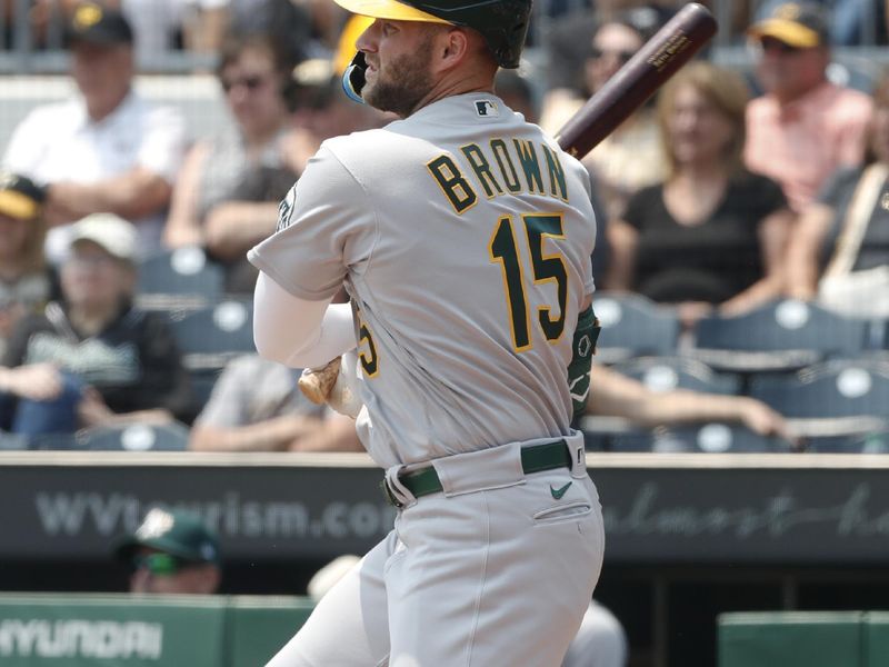 Jun 7, 2023; Pittsburgh, Pennsylvania, USA;  Oakland Athletics left fielder Seth Brown (15) hits a single against the Pittsburgh Pirates during the first inning at PNC Park. Mandatory Credit: Charles LeClaire-USA TODAY Sports