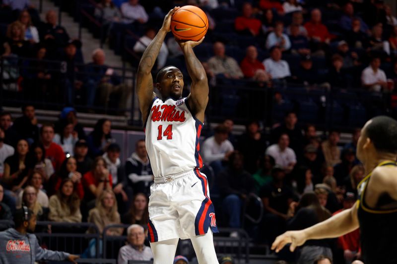 Jan 24, 2023; Oxford, Mississippi, USA; Mississippi Rebels guard Tye Fagan (14) shoots for three during the second half against the Missouri Tigers at The Sandy and John Black Pavilion at Ole Miss. Mandatory Credit: Petre Thomas-USA TODAY Sports