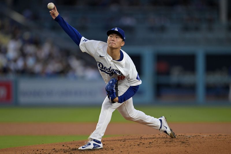 May 20, 2024; Los Angeles, California, USA;  Los Angeles Dodgers starting pitcher Yoshinobu Yamamoto (18) delivers to the plate in the third inning against the Arizona Diamondbacks at Dodger Stadium. Mandatory Credit: Jayne Kamin-Oncea-USA TODAY Sports