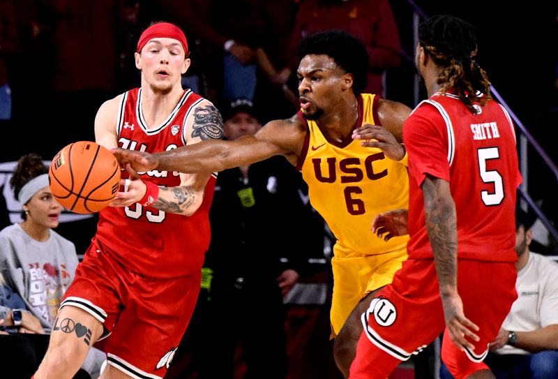 Feb 15, 2024; Los Angeles, California, USA; Southern California Trojans guard Bronny James (6) knocks the ball away from Utah Utes guard Gabe Madsen (55) during the second half at Galen Center. Mandatory Credit: Alex Gallardo-USA TODAY Sports