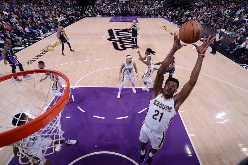 SACRAMENTO, CA - FEBRUARY 8:  Yves Missi #21 of the New Orleans Pelicans rebounds the ball during the game against the Sacramento Kings on February 8, 2025 at Golden 1 Center in Sacramento, California. NOTE TO USER: User expressly acknowledges and agrees that, by downloading and or using this Photograph, user is consenting to the terms and conditions of the Getty Images License Agreement. Mandatory Copyright Notice: Copyright 2025 NBAE (Photo by Rocky Widner/NBAE via Getty Images)