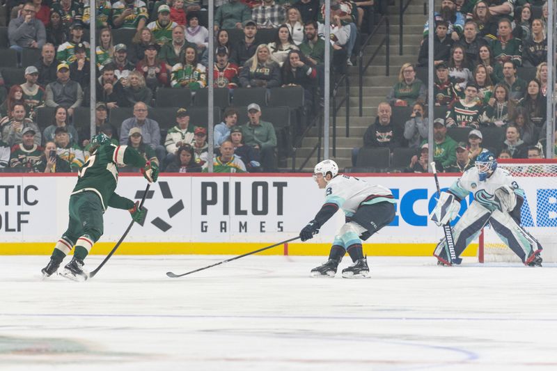 Apr 18, 2024; Saint Paul, Minnesota, USA; Minnesota Wild left wing Kirill Kaprizov (97) shoots and scores his 46th goal of the season on a power play in the first period against the Seattle Kraken at Xcel Energy Center. Mandatory Credit: Matt Blewett-USA TODAY Sports