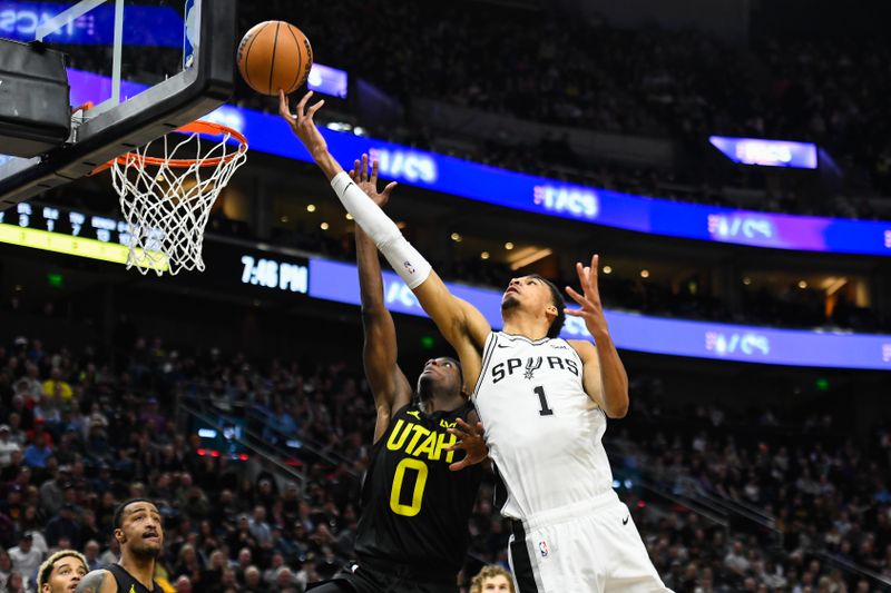 SALT LAKE CITY, UTAH - MARCH 27: Victor Wembanyama #1 of the San Antonio Spurs shoots over Taylor Hendricks #0 of the Utah Jazz during the first half of a game at Delta Center on March 27, 2024 in Salt Lake City, Utah. NOTE TO USER: User expressly acknowledges and agrees that, by downloading and or using this photograph, User is consenting to the terms and conditions of the Getty Images License Agreement. (Photo by Alex Goodlett/Getty Images)