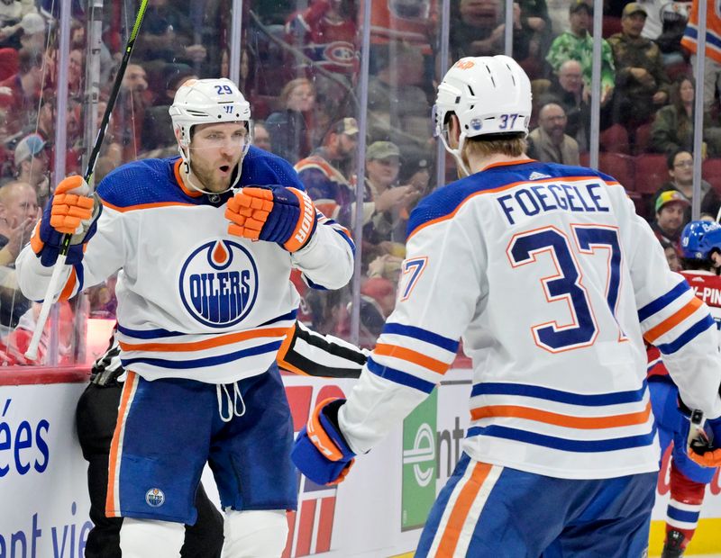 Jan 13, 2024; Montreal, Quebec, CAN; Edmonton Oilers forward Leon Draisaitl (29) celebrates with teammate forward Warren Foegele (37) after scoring a goal against the Montreal Canadiens during the third period at the Bell Centre. Mandatory Credit: Eric Bolte-USA TODAY Sports