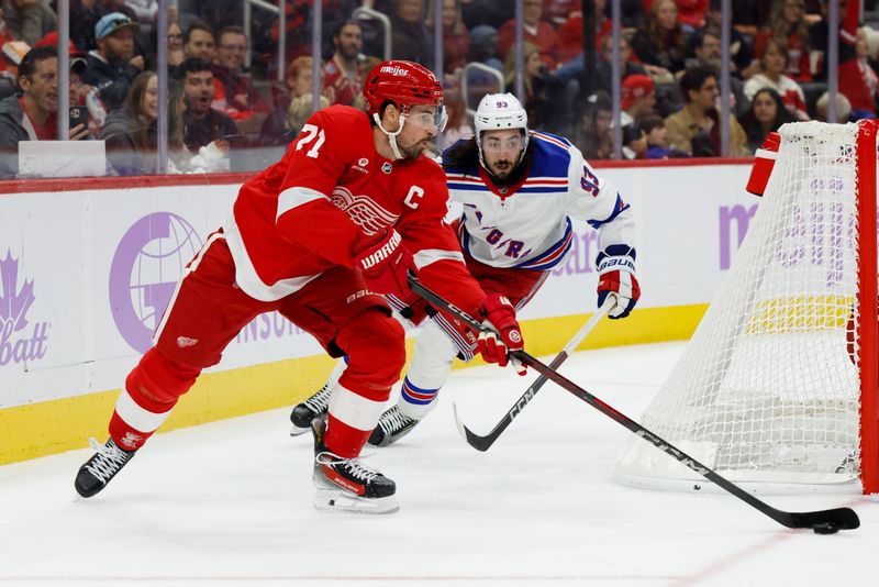 Nov 9, 2024; Detroit, Michigan, USA;  Detroit Red Wings center Dylan Larkin (71) skates with the puck against the New York Rangers in the second period at Little Caesars Arena. Mandatory Credit: Rick Osentoski-Imagn Images