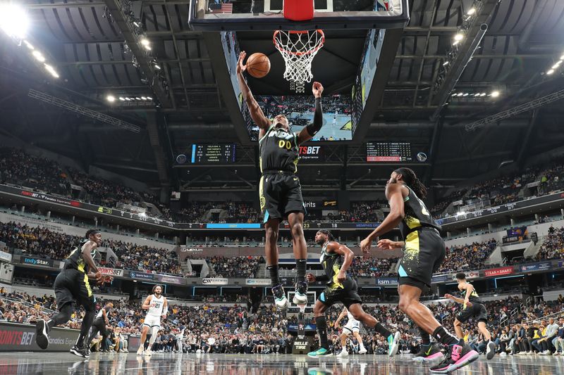 INDIANAPOLIS, IN - JANUARY 28: Bennedict Mathurin #00 of the Indiana Pacers rebounds during the game against the Memphis Grizzlies on January 28, 2024 at Gainbridge Fieldhouse in Indianapolis, Indiana. NOTE TO USER: User expressly acknowledges and agrees that, by downloading and or using this Photograph, user is consenting to the terms and conditions of the Getty Images License Agreement. Mandatory Copyright Notice: Copyright 2024 NBAE (Photo by Jeff Haynes/NBAE via Getty Images)