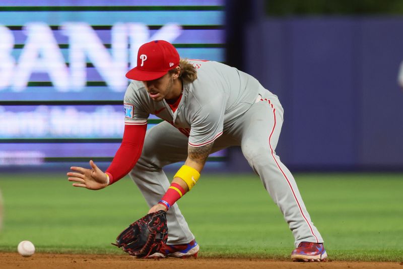 Sep 5, 2024; Miami, Florida, USA; Philadelphia Phillies second baseman Bryson Stott (5) catches a ground ball before throwing to first base to retire Miami Marlins right fielder Jesus Sanchez (not pictured) during the ninth inning at loanDepot Park. Mandatory Credit: Sam Navarro-Imagn Images