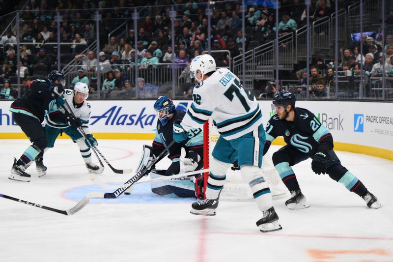 Nov 22, 2023; Seattle, Washington, USA; Seattle Kraken goaltender Joey Daccord (35) blocks a goal shot by San Jose Sharks center William Eklund (72) during the third period at Climate Pledge Arena. Mandatory Credit: Steven Bisig-USA TODAY Sports