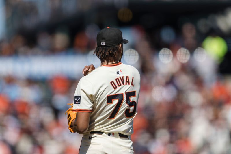 Apr 28, 2024; San Francisco, California, USA;  San Francisco Giants pitcher Camilo Doval (75) prepares to throw against the Pittsburgh Pirates during the ninth inning at Oracle Park. Mandatory Credit: John Hefti-USA TODAY Sports