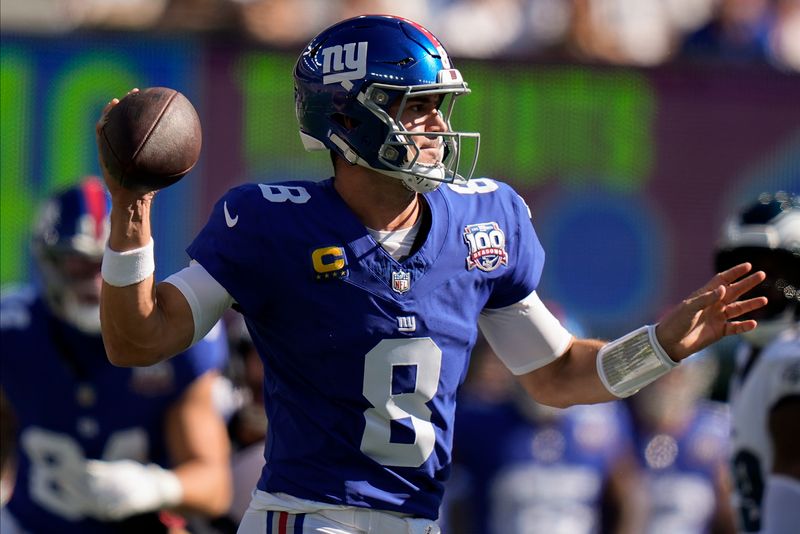 New York Giants quarterback Daniel Jones (8) passes against the Philadelphia Eagles during the first quarter of an NFL football game, Sunday, Oct. 20, 2024, in East Rutherford, N.J. (AP Photo/Frank Franklin II)