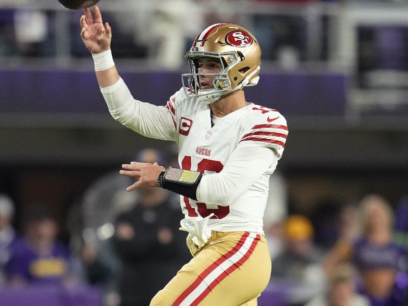 San Francisco 49ers quarterback Brock Purdy (13) passes during the first half of an NFL football game against the Minnesota Vikings, Monday, Oct. 23, 2023, in Minneapolis. (AP Photo/Abbie Parr)