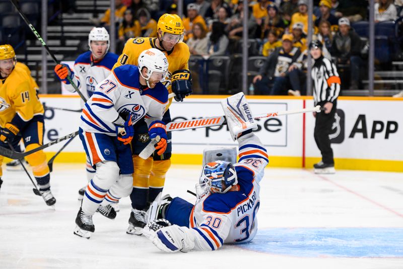 Oct 31, 2024; Nashville, Tennessee, USA;  Edmonton Oilers goaltender Calvin Pickard (30) blocks the shot of Nashville Predators center Colton Sissons (10) during the third period at Bridgestone Arena. Mandatory Credit: Steve Roberts-Imagn Images