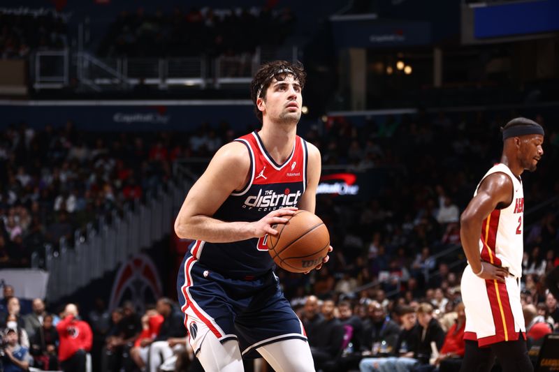 WASHINGTON, DC -? MARCH 31:  Deni Avdija #8 of the Washington Wizards shoots a free throw during the game against the Miami Heat on March 31, 2024 at Capital One Arena in Washington, DC. NOTE TO USER: User expressly acknowledges and agrees that, by downloading and or using this Photograph, user is consenting to the terms and conditions of the Getty Images License Agreement. Mandatory Copyright Notice: Copyright 2024 NBAE (Photo by Kenny Giarla/NBAE via Getty Images)