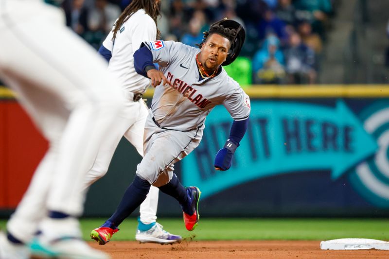 Apr 2, 2024; Seattle, Washington, USA; Cleveland Guardians third baseman Jose Ramirez (11) advances home to score a run on a fielding error by the Seattle Mariners during the fourth inning at T-Mobile Park. Mandatory Credit: Joe Nicholson-USA TODAY Sports