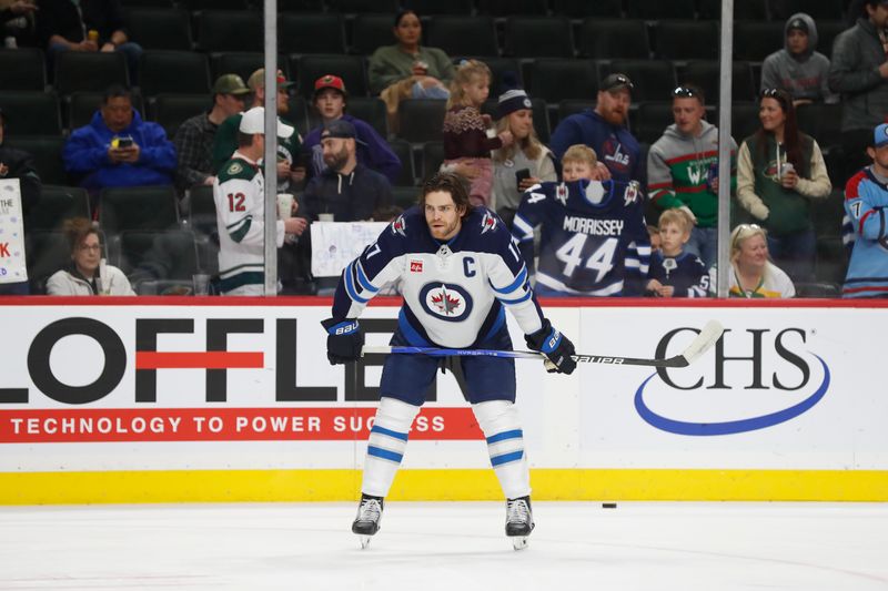 Apr 6, 2024; Saint Paul, Minnesota, USA; Winnipeg Jets center Adam Lowry (17) warms up before a game against the Minnesota Wild at Xcel Energy Center. Mandatory Credit: Bruce Fedyck-USA TODAY Sports