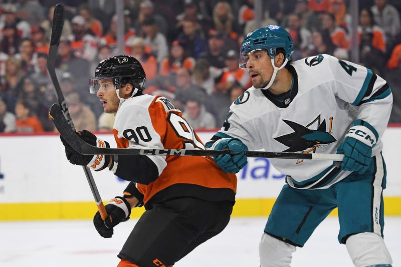 Nov 11, 2024; Philadelphia, Pennsylvania, USA; Philadelphia Flyers center Anthony Richard (90) and San Jose Sharks defenseman Cody Ceci (4) battle for position during the first period at Wells Fargo Center. Mandatory Credit: Eric Hartline-Imagn Images