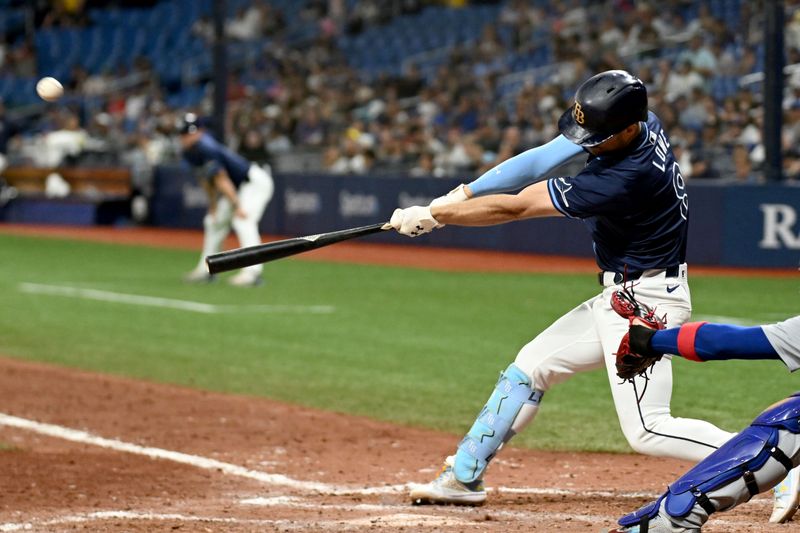 Jun 11, 2024; St. Petersburg, Florida, USA; Tampa Bay Rays designated hitter Brandon Lowe (8) hits a three run game winning home run in the ninth inning against the Chicago Cubs at Tropicana Field. Mandatory Credit: Jonathan Dyer-USA TODAY Sports