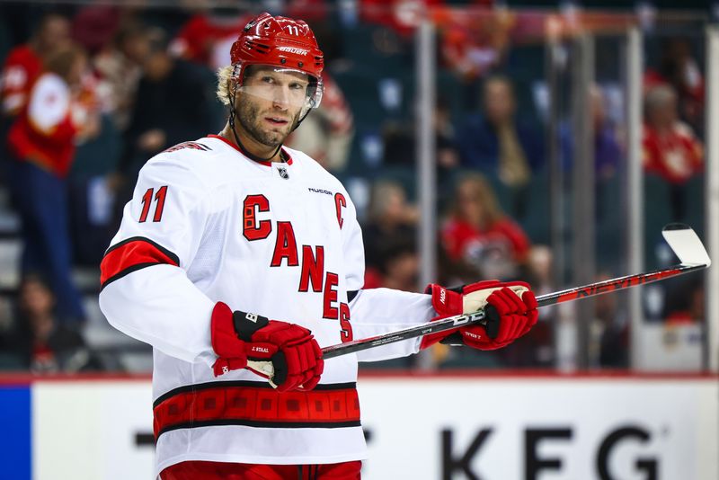 Oct 24, 2024; Calgary, Alberta, CAN; Carolina Hurricanes center Jordan Staal (11) during the second period against the Calgary Flames at Scotiabank Saddledome. Mandatory Credit: Sergei Belski-Imagn Images