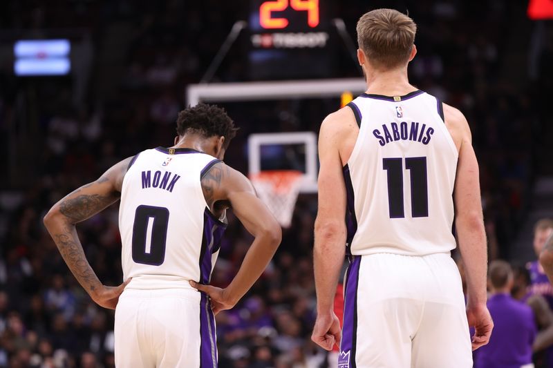 TORONTO, CANADA - NOVEMBER 2: Malik Monk #0 and Domantas Sabonis #11 of the Sacramento Kings look on during the game against the Toronto Raptors on November 2, 2024 at the Scotiabank Arena in Toronto, Ontario, Canada.  NOTE TO USER: User expressly acknowledges and agrees that, by downloading and or using this Photograph, user is consenting to the terms and conditions of the Getty Images License Agreement.  Mandatory Copyright Notice: Copyright 2024 NBAE (Photo by Joe Murphy/NBAE via Getty Images)