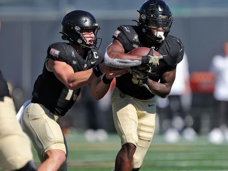 Oct 12, 2024; West Point, New York, USA; Army Black Knights running back Kanye Udoh (6) takes a handoff from  quarterback Bryson Daily (13) during the first half against the UAB Blazers at Michie Stadium. Mandatory Credit: Danny Wild-Imagn Images