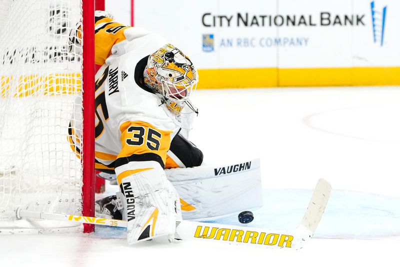 Jan 20, 2024; Las Vegas, Nevada, USA; Pittsburgh Penguins goaltender Tristan Jarry (35) makes a save against the Vegas Golden Knights during the third period at T-Mobile Arena. Mandatory Credit: Stephen R. Sylvanie-USA TODAY Sports