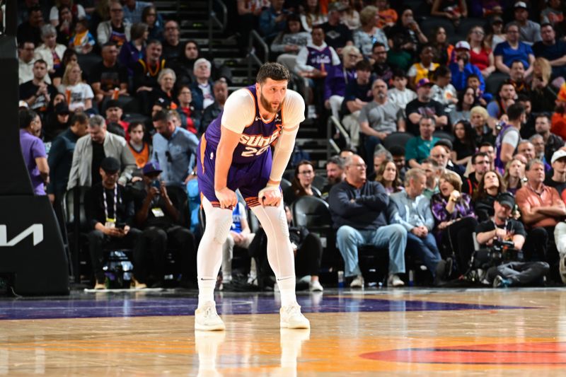 PHOENIX, AZ - MARCH 2:  Jusuf Nurkic #20 of the Phoenix Suns looks on during the game against the Houston Rockets on March 2, 2024 at Footprint Center in Phoenix, Arizona. NOTE TO USER: User expressly acknowledges and agrees that, by downloading and or using this photograph, user is consenting to the terms and conditions of the Getty Images License Agreement. Mandatory Copyright Notice: Copyright 2023 NBAE (Photo by Kate Frese/NBAE via Getty Images)