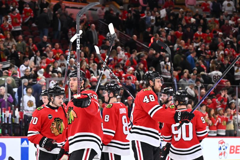 Dec 19, 2023; Chicago, Illinois, USA; The Chicago Blackhawks salute their fans after defeating the Colorado Avalanche 3-2 at United Center. Mandatory Credit: Jamie Sabau-USA TODAY Sports