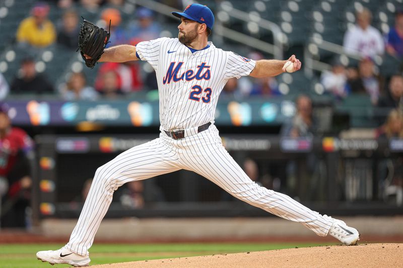 Apr 29, 2025; New York City, New York, USA; New York Mets starting pitcher David Peterson (23) delivers a pitch during the first inning against the Arizona Diamondbacks at Citi Field. Mandatory Credit: Vincent Carchietta-Imagn Images