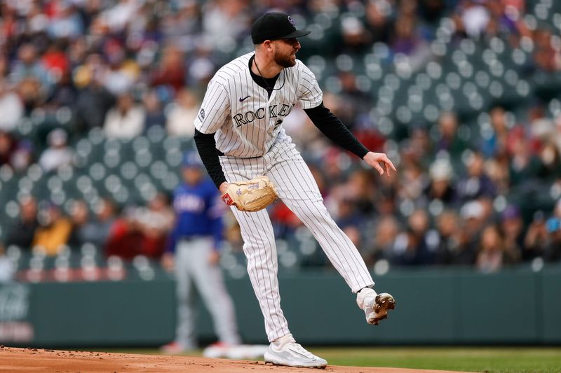 May 10, 2024; Denver, Colorado, USA; Colorado Rockies starting pitcher Austin Gomber (26) pitches in the first inning against the Texas Rangers at Coors Field. Mandatory Credit: Isaiah J. Downing-USA TODAY Sports