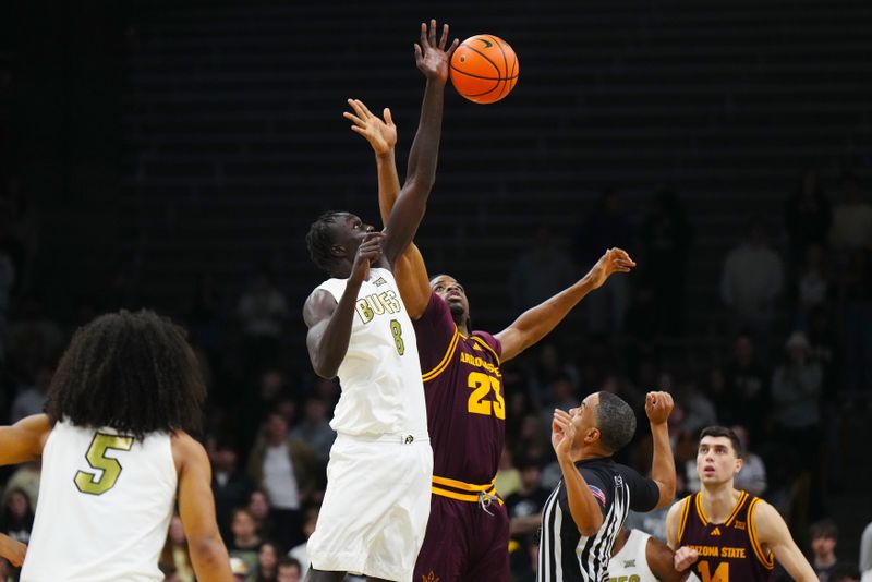 Feb 7, 2026; Boulder, Colorado, USA; Colorado Buffaloes forward Bangot Dak (8) and Arizona State Sun Devils forward Allen Mukeba (23) reach for the tip off in the first half at the CU Events Center. Mandatory Credit: Ron Chenoy-Imagn Images