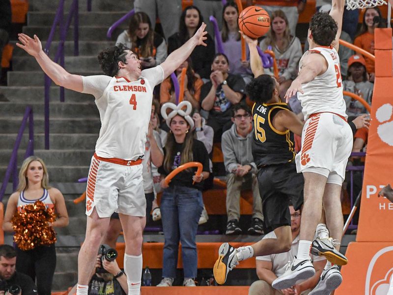 Feb 27, 2024; Clemson, South Carolina, USA; Clemson junior forward PJ Hall (24) blocks a shot by Pitt guard Jaland Lowe (15) during the second half at Littlejohn Coliseum. Mandatory Credit: Ken Ruinard-USA TODAY Sports