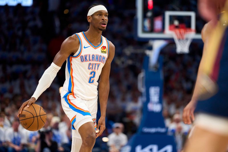 OKLAHOMA CITY, OKLAHOMA - APRIL 21: Shai Gilgeous-Alexander #2 of the Oklahoma City Thunder brings the ball up court against the New Orleans Pelicans in game one of the Western Conference First Round Playoffs at the Paycom Center on April 21, 2024 in Oklahoma City, Oklahoma. NOTE TO USER: User expressly acknowledges and agrees that, by downloading and or using this photograph, User is consenting to the terms and conditions of the Getty Images License Agreement.  (Photo by Cooper Neill/Getty Images)