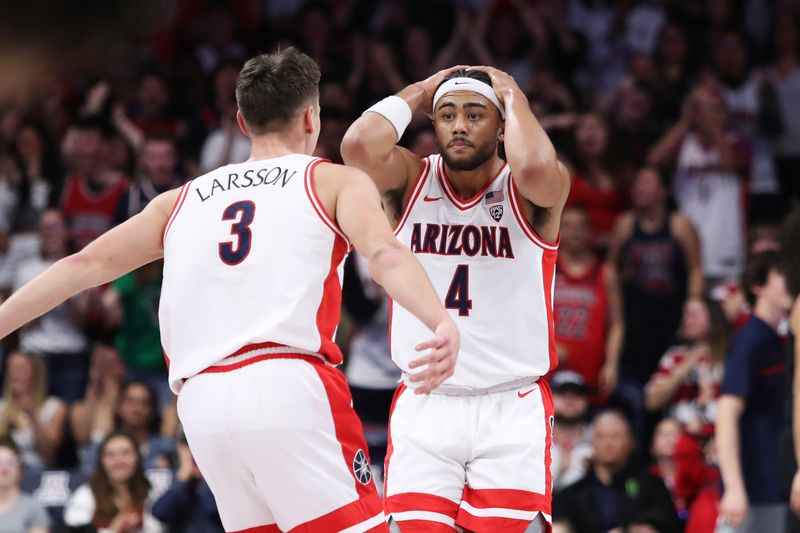 Feb 18, 2023; Tucson, Arizona, USA; Arizona Wildcats guard Kylan Boswell (4) after he is called for a foul for holding onto the rim with Arizona Wildcats guard Pelle Larsson (3) during the first half at McKale Center. Mandatory Credit: Zachary BonDurant-USA TODAY Sports