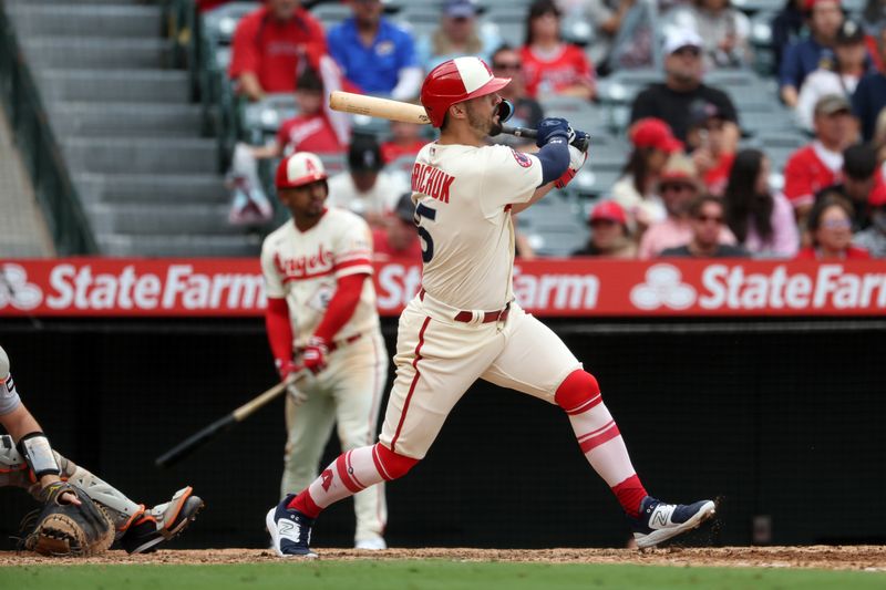 Sep 17, 2023; Anaheim, California, USA; Los Angeles Angels left fielder Randal Grichuk (15) hits a 2-run home run during the sixth inning against the Detroit Tigers at Angel Stadium. Mandatory Credit: Kiyoshi Mio-USA TODAY Sports