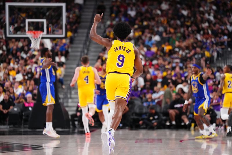 LAS VEGAS, NV - OCTOBER 15: Bronny James #9 of the Los Angeles Lakers looks on during the game against the Golden State Warriors during the 2024 NBA Preseason on October 15, 2024 at T-Mobile Arena in Las Vegas, Nevada. NOTE TO USER: User expressly acknowledges and agrees that, by downloading and or using this photograph, User is consenting to the terms and conditions of the Getty Images License Agreement. Mandatory Copyright Notice: Copyright 2024 NBAE  (Photo by Jeff Bottari/NBAE via Getty Images)